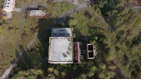 Flying over the top of a shut down coal mine dolly forward 動画素材 162910573