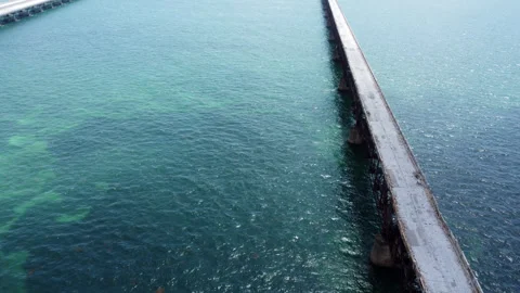 Flying over the top of what is left of the Flagler Railway bridge Stock Footage 343900609