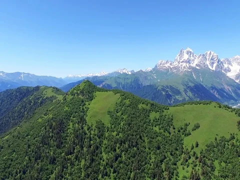Flying over town Mestia and Mountain Valley Aerial 4k video Stock Footage 80314469