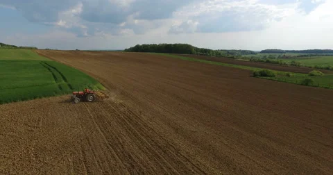Flying over tractor in the nature. Video stock 62906721