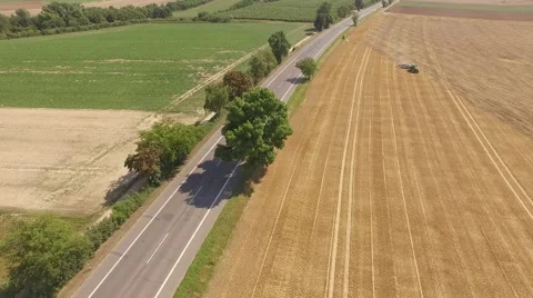 Flying over tractor working on a field Stock Footage 52963510