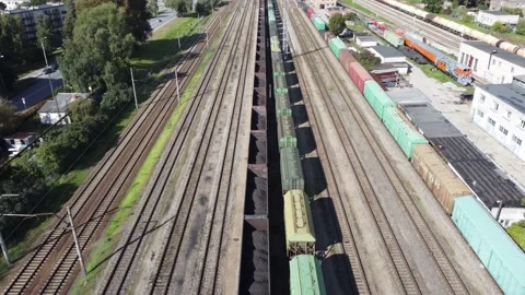 Flying over train depot and carriages with coal. Stock Footage 163538562