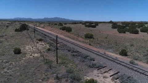 Flying over train tracks in the desert #2 Stock Footage 79237165