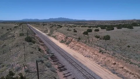 Flying over train tracks in the desert #3 Stock-Footage 79237604