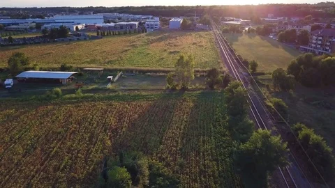 Flying over the train tracks at sunset Stock-Footage 79732069