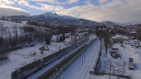 Flying over the train in  the Winter Landscape Stock Footage 86999071