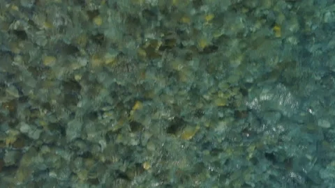 Flying over the transparent water surface Stock Footage 86536629