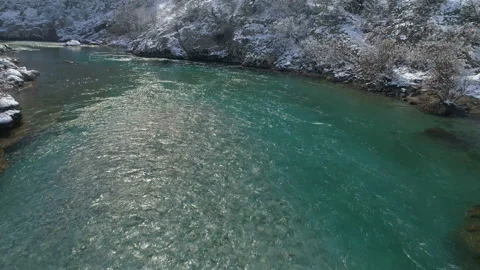 Flying over the transparent winter mountain river Moraca, Montenegro 動画素材 86539193