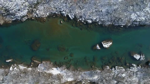 Flying over the transparent winter mountain river Moraca, Montenegro Video stock 86539504