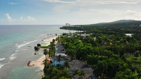 Flying over tropical beach in Montego Bay in Jamaica. Unveiling private Stock-Footage 229752850