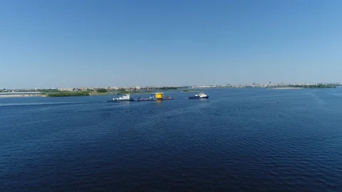Flying over a Tug Pulling a Barge. Transporter. Tatarstan. Volga River. Stock Footage 127789887