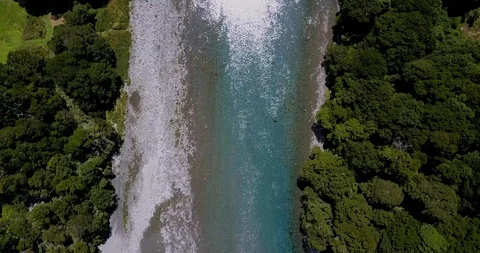 Flying over turquoise river green forest and bridge in South Island, New Zealand Stock-Footage 90539152