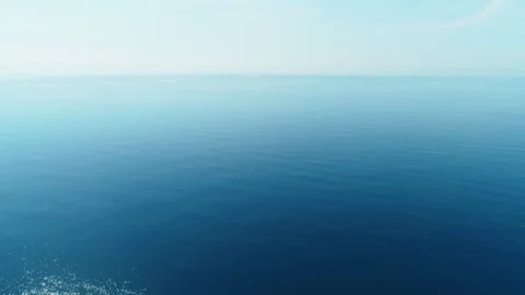 Flying over the turquoise water over the calm sea. Sea background. Stock Footage 111624481