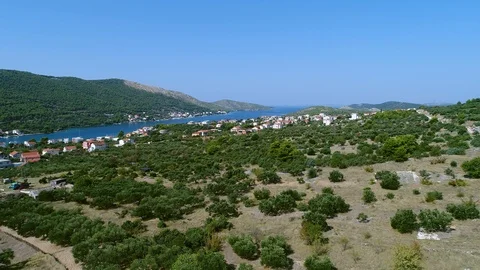 Flying over a typical Dalmatian landscape on a sunny summer day Stock Footage 100724090