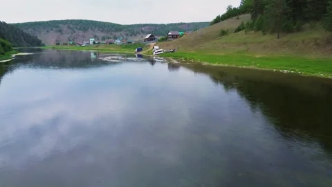 Flying over under the water in the forest Near the village Stock Footage 246580261