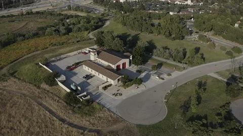 Flying over a US Fire Station in Orange County California with a US Flag Flying. Stock Footage 108781103