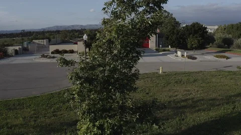 Flying over a US Fire Station in Orange County California with a US Flag Flying. Stock Footage 108801903