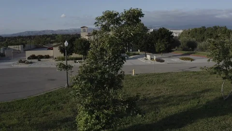 Flying over a US Fire Station in Orange County California with a US Flag Flying. Stock Footage 108804253