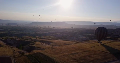Flying over the valley. The ball rises, revealing a valley and other balls. Stock Footage 104861050