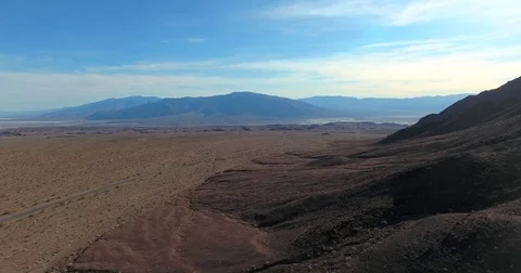 Flying over vast desert mountain landscape in California Stock Footage 72960776