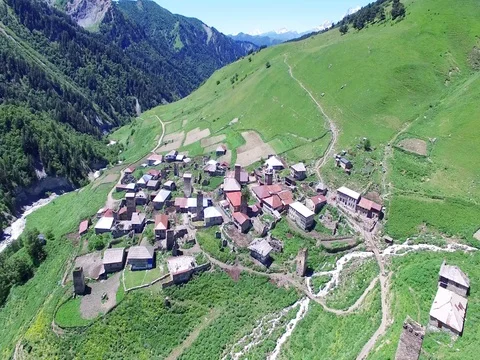 Flying over village Ushguli Mountain Valley Aerial 4k video. Hiking Tourism Stock Footage 80314535