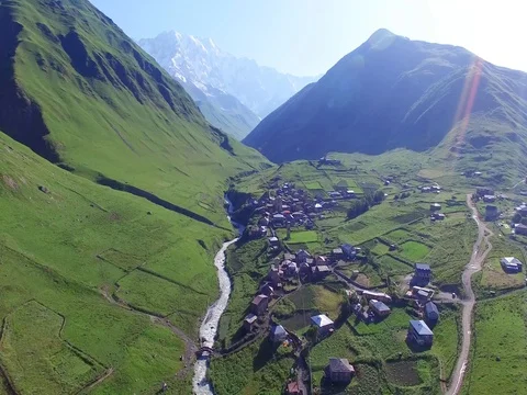 Flying over village Ushguli Mountain Valley Aerial 4k video. Hiking Tourism Stock Footage 80314599
