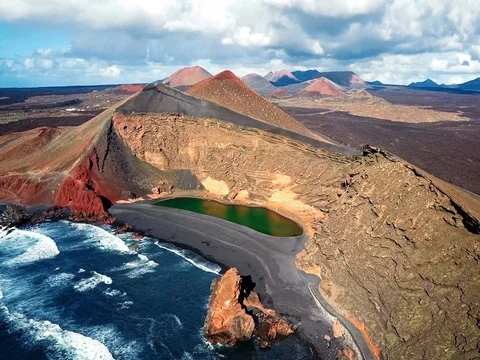 Flying over Volcanic Lake El Golfo, Lanzarote, Canary Islands, Spain Stock Footage