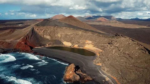 Flying over Volcanic Lake El Golfo, Lanzarote, Canary Islands. Video stock 88324082