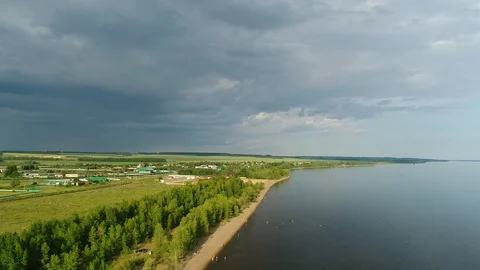 Flying Over the Volga River With a View of the Overcast Sky and the Countryside. Stock Footage 126280768