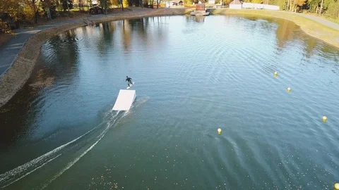 Flying over wakeboarding on river 4k aerial video. Видео 98819191