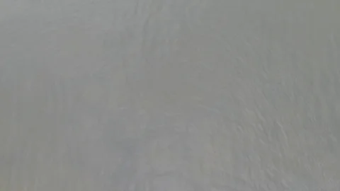 Flying over water. Arial drone shot of sea, waves, coast and forest. Stock Footage 112887100