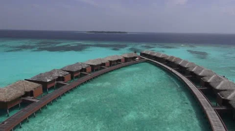 Flying over water bungalows Stock Footage 15366104