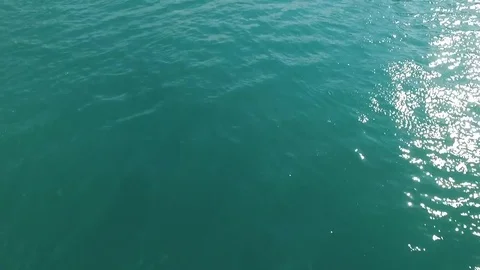 Flying over the water surface of the azure sea Stock Footage 69925474