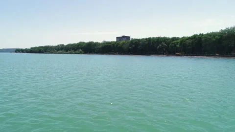 Flying over the water surface on a summer day Video stock 153001524