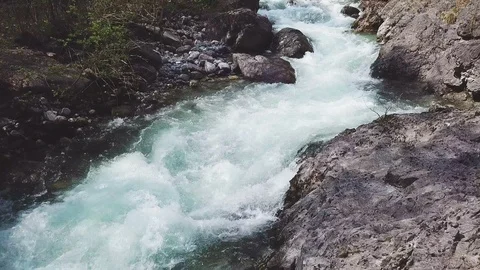 Flying over a waterfall with a 4k drone - aerial cinematic view shot on sunrise 스톡 동영상 88967454