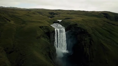 Flying over the waterfall to the foot of the mountain Stock Footage 297867741