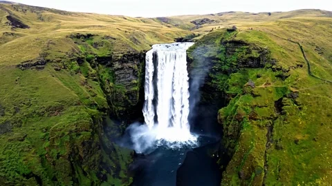 Flying over the waterfall to the foot of the mountain Island. Stock Footage 297873049