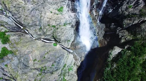 Flying over waterfall rainbow rocky mountains 4k nature video. Caucasus Georgia Stock Footage 68458819