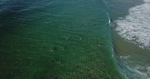 Flying over a wave of ocean along a deserted sandy shore Stock Footage 130168844
