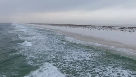 Flying over the waves along the beach Stock Footage 247033700