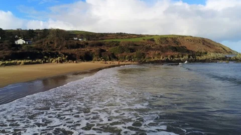 Flying over waves on a beach Stock Footage 103861997