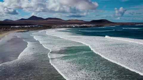 Flying over the waves on the beach Stockbeeldmateriaal 140938842
