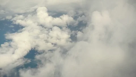 Flying over the white clouds. The view from the airplane window. Stock Footage 120686635