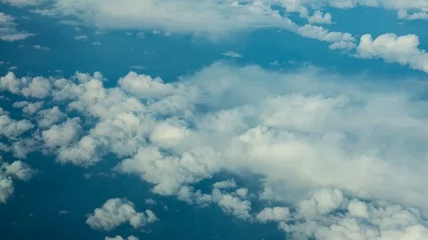 Flying over white fluffy clouds Stock Footage 124032394