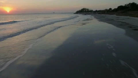 Flying over white foam beach waves Stock Footage 167372049