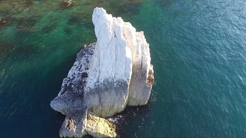 Flying over a white rock Stock Footage 105974004