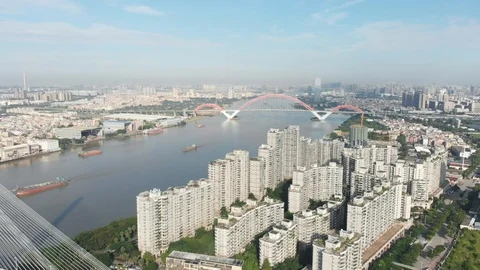 Flying over a whole complex of multi-storey houses standing on the river bank. Video stock 113666632