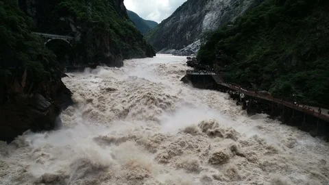 Flying over wild river in rainy season, slow motion aerial footage China Vídeos de archivo 99168385