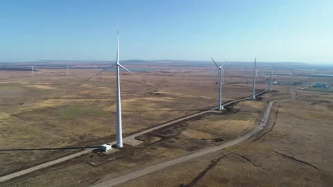 Flying over a wind farm on a clear day Video stock 153443180