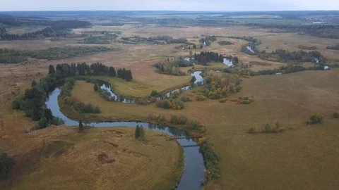 Flying over a winding river. Drone view Stockbeeldmateriaal 105275238
